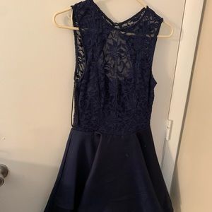 A knee length navy blue prom dress